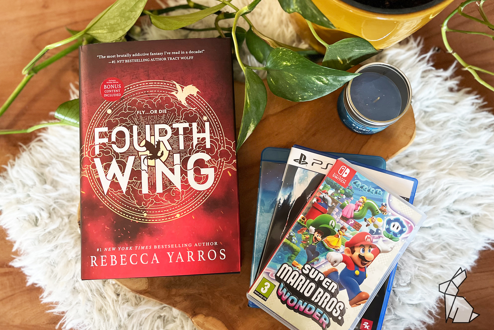 boek van fourth wing en nintendo switch game super mario bros wonder